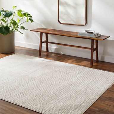 Arny Solid Color Machine Woven Polyester Area Rug in Cream