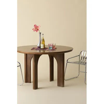 Carrie Round Mango Wood Dining Table in Natural at Urban Outfitters
