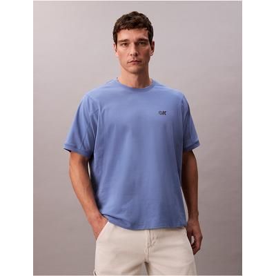 Calvin Klein Men's Cooling Pique Logo Graphic Relaxed T-Shirt in Dull Nile Blue 63% Cotton/34% Polyester/3% Elastane